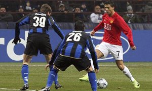 Ronaldo is double teamed against Inter (Image from PA)