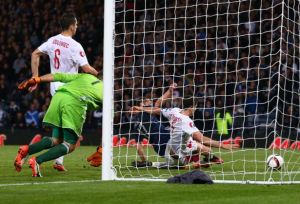 Poland's last minute equalizer knocked Scotland out of contention (Image from PA)